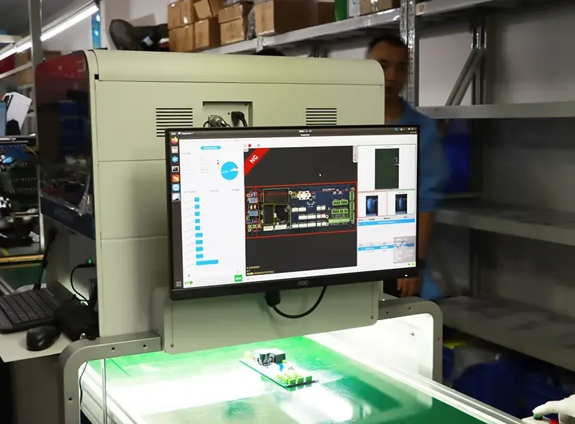 Automated optical inspection system scanning printed circuit board for quality control in electronics manufacturing